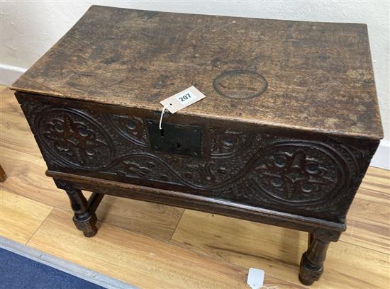 An 18th century oak bible box on associated stand, width 62cm, depth 34cm, height 49cm